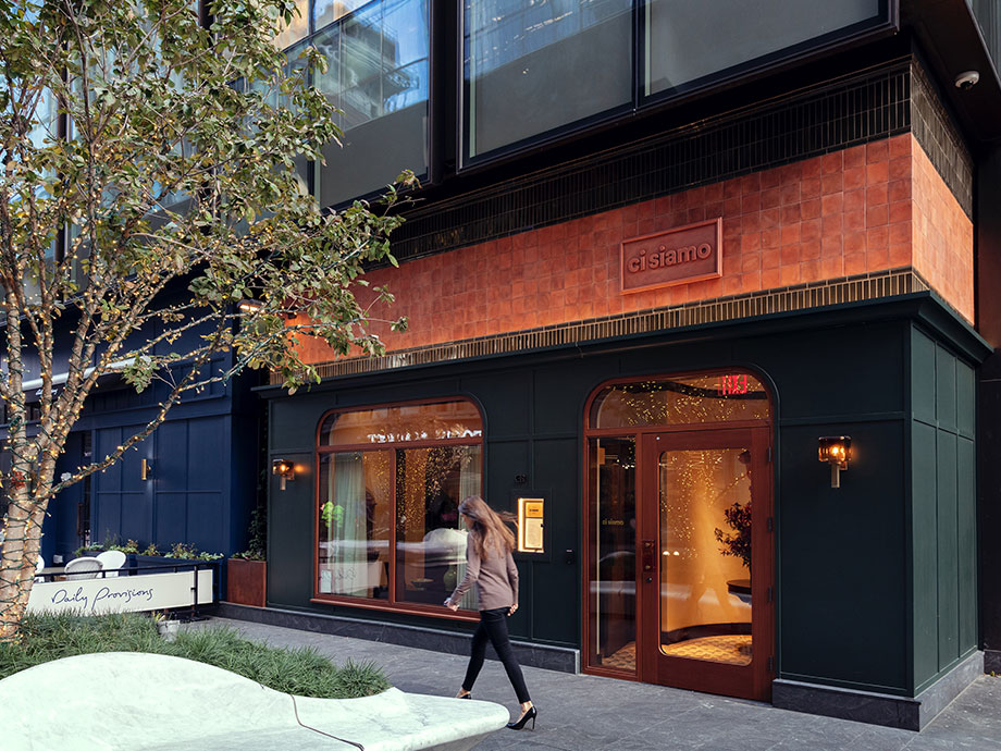 A woman walks past Ci Siamo restaurant in NYC